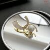 Double moon brooch