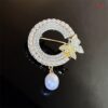 Round butterfly brooch