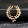 Two pearl leaf brooch