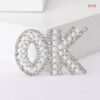 Ok brooch