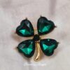 Green four leaf brooch